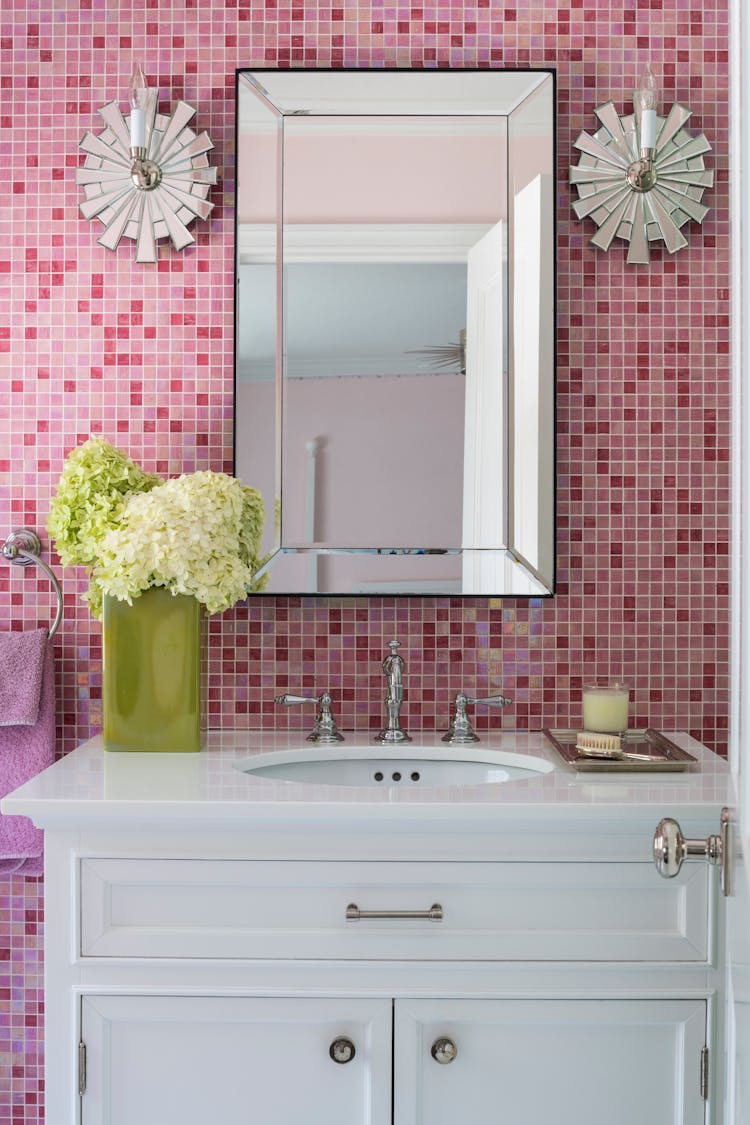 Stylish kids’ bathroom in a Long Island Colonial Revival home featuring custom tilework and playful design elements, designed by K.A. Murphy Interiors