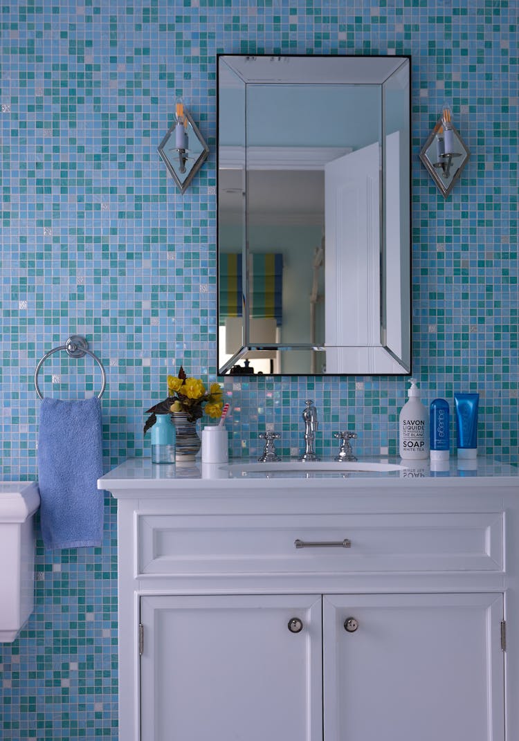 Stylish kids’ bathroom in a Long Island Colonial Revival home featuring custom tilework and playful design elements, designed by K.A. Murphy Interiors