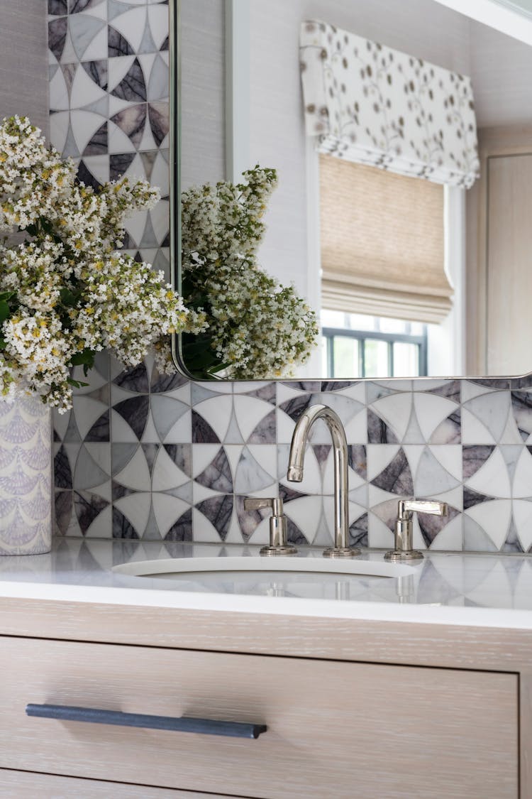 Detailed view of custom vanity design in a Long Island spa bathroom, showcasing materials and finishes, by K.A. Murphy Interiors