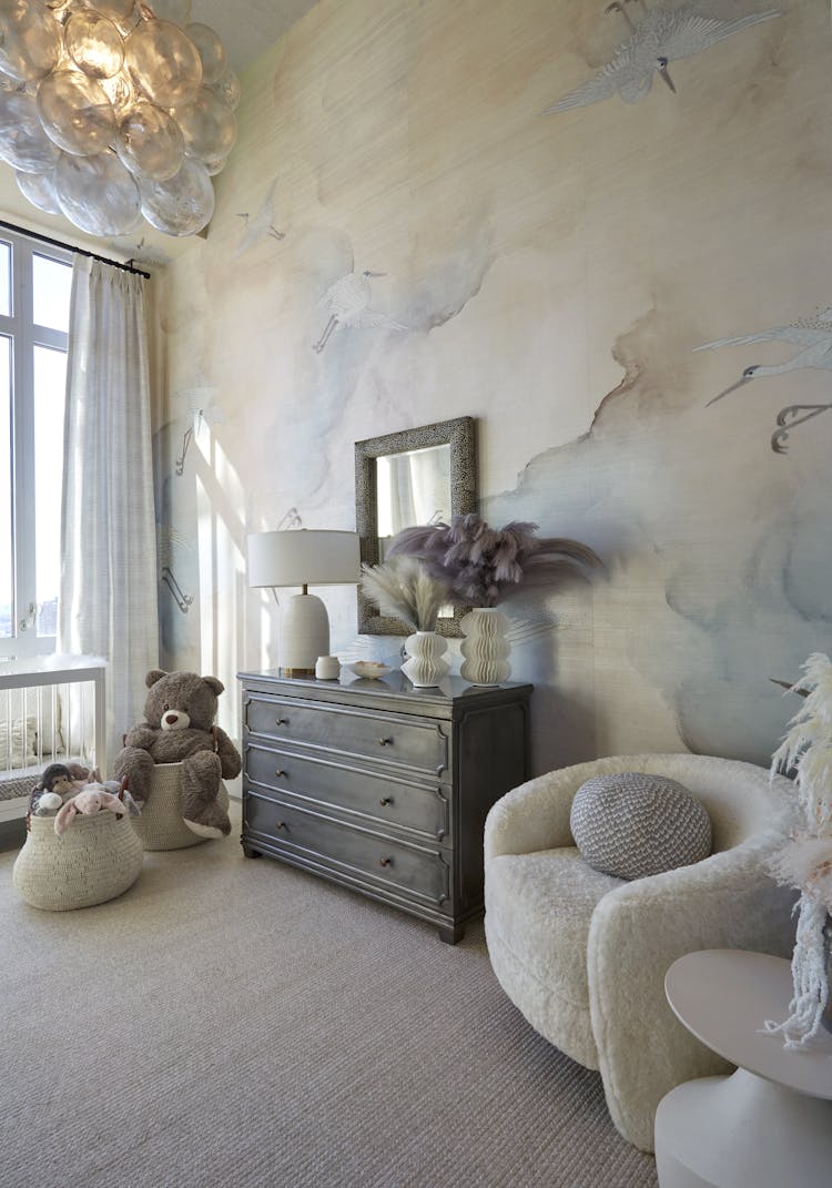 Comfortable corner chair with soft upholstery in a New York nursery, designed by K.A. Murphy Interiors