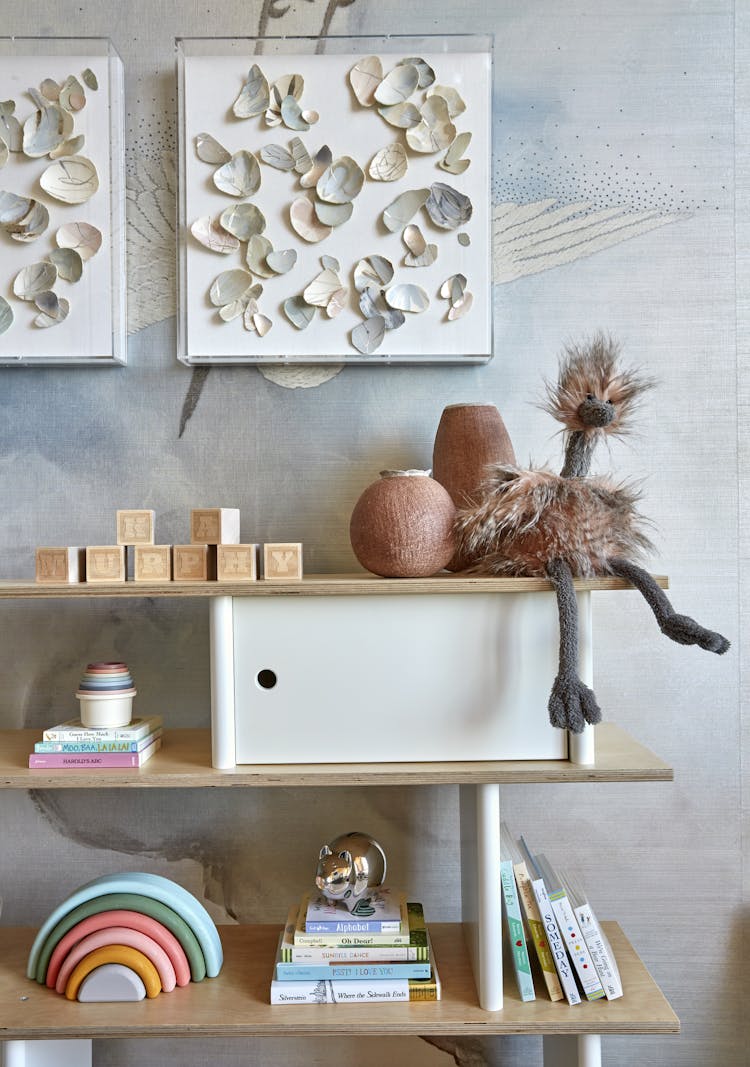 Close-up of curated toys on a shelf in a Manhattan nursery, designed by K.A. Murphy Interiors