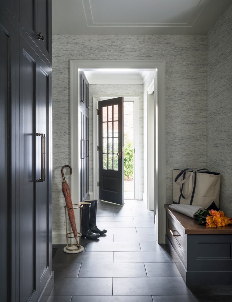 Welcoming entryway with custom design in a Long Island family home, designed by K.A. Murphy Interiors.