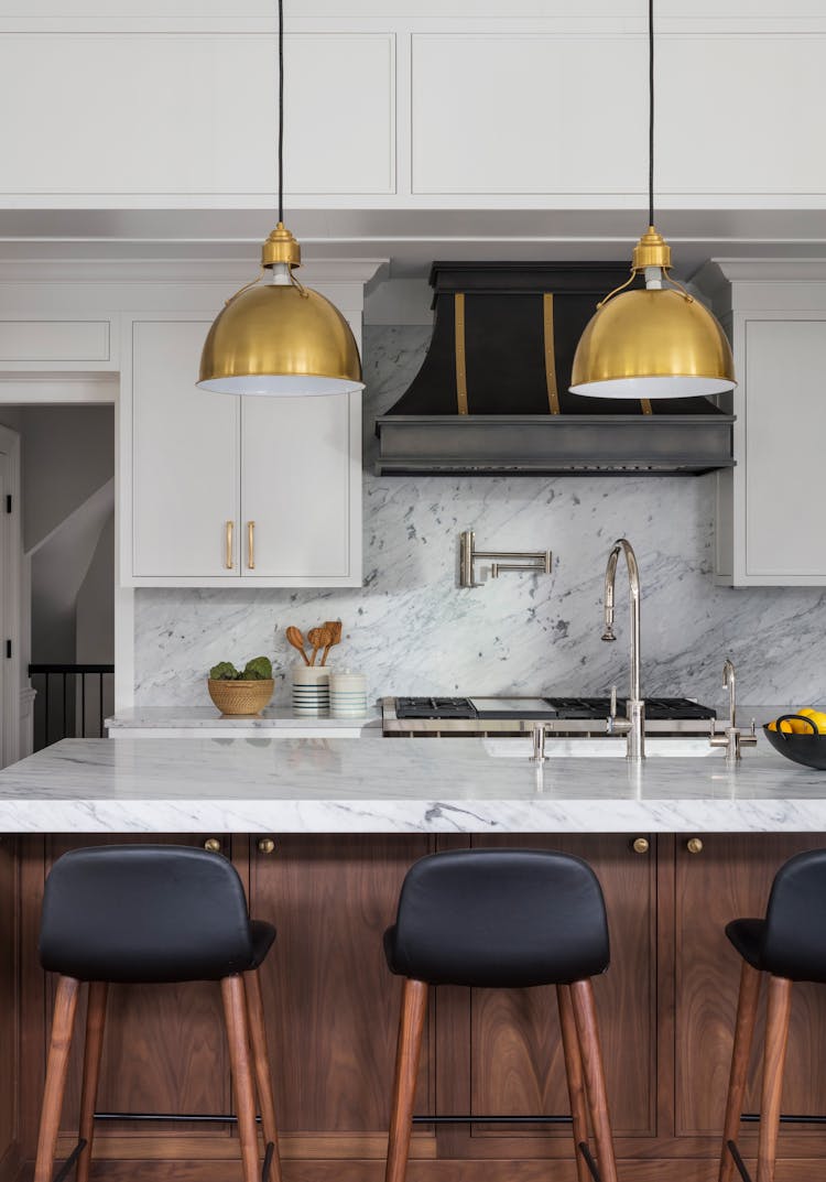 Close-up of a modern kitchen island with sleek finishes in a Long Island family home, designed by K.A. Murphy Interiors
