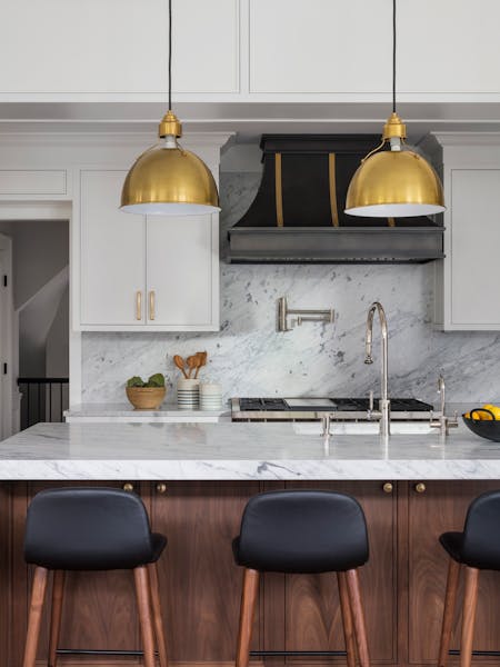 Close-up of a modern kitchen island with sleek finishes in a Long Island family home, designed by K.A. Murphy Interiors