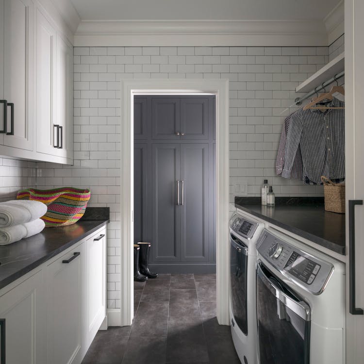 Functional mudroom with built-in storage in a Long Island family home, designed by K.A. Murphy Interiors