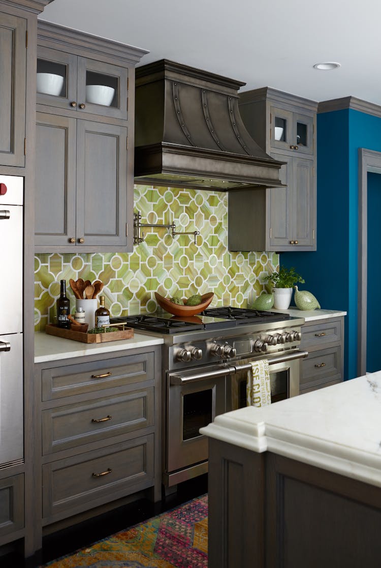 Modern kitchen in a Long Island Colonial Revival home featuring custom cabinetry, high-end appliances, and timeless design elements, designed by K.A. Murphy Interiors