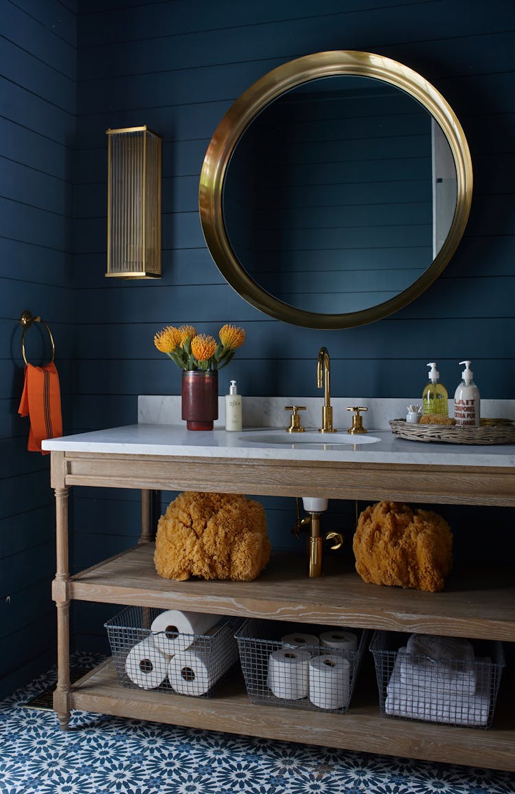 Modern pool house bathroom in a Long Island Colonial Revival home with sleek finishes and functional design, designed by K.A. Murphy Interiors