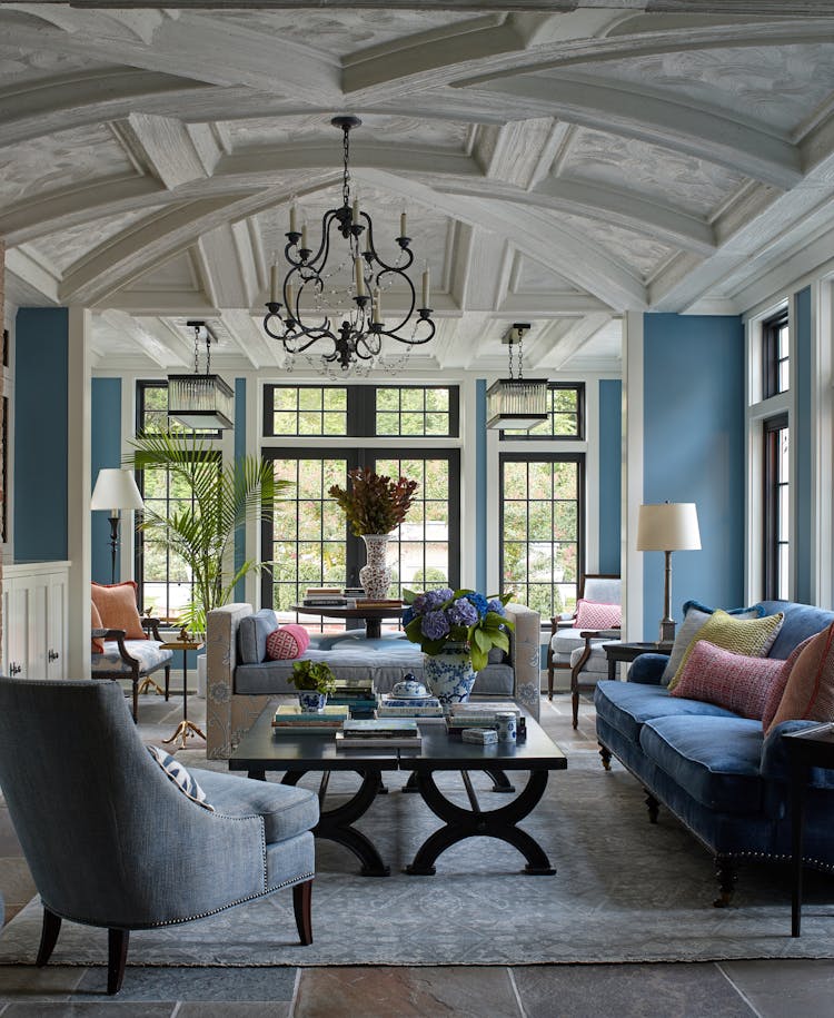 Elegant living room in a Long Island Colonial Revival home featuring a neutral color palette, traditional furnishings, and classic architectural details, designed by K.A. Murphy Interiors