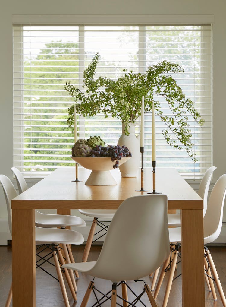 Close-up of kitchen table in a Montauk retreat, showcasing coastal-inspired tableware and decor, designed by K.A. Murphy Interiors