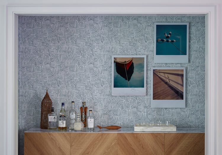 Stylish bar area in a Montauk beach house featuring modern fixtures and coastal accents, designed by K.A. Murphy Interiors