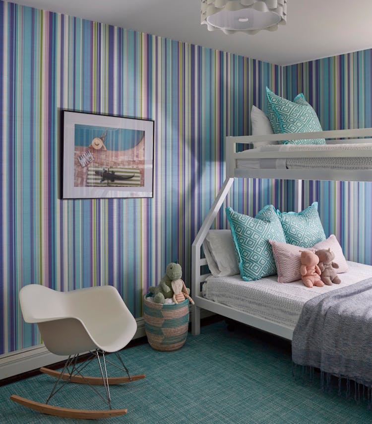 Playful bunk room in a Montauk retreat designed for children, featuring coastal-themed decor, by K.A. Murphy Interiors