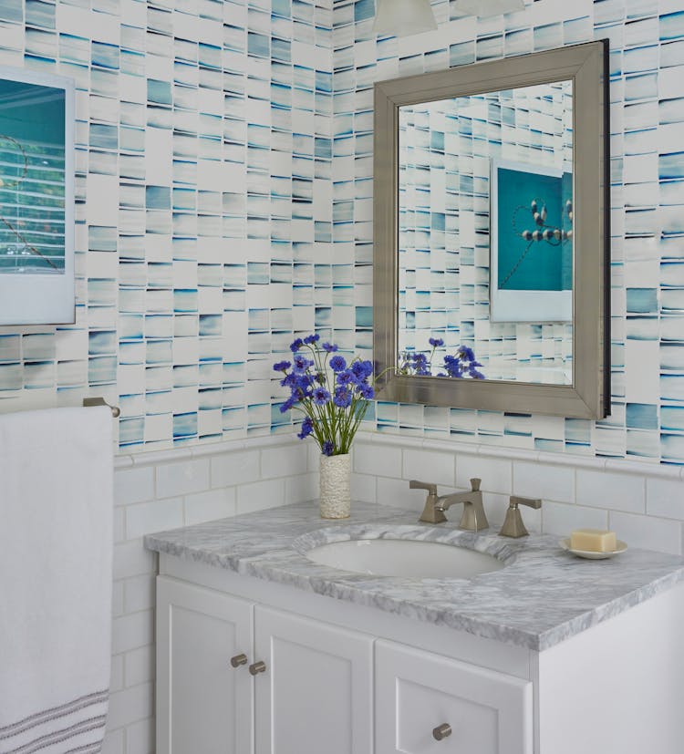 Stylish half bathroom in a Montauk beach house with coastal accents, designed by K.A. Murphy Interiors