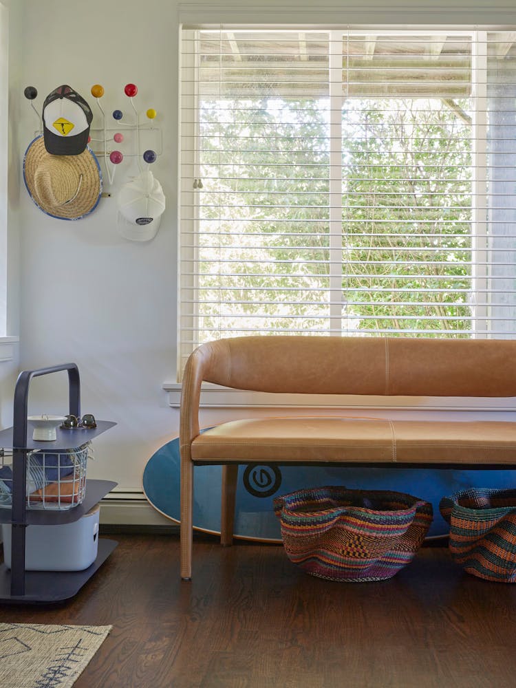 Functional mudroom in a Montauk beach house with built-in storage and coastal accents, designed by K.A. Murphy Interiors