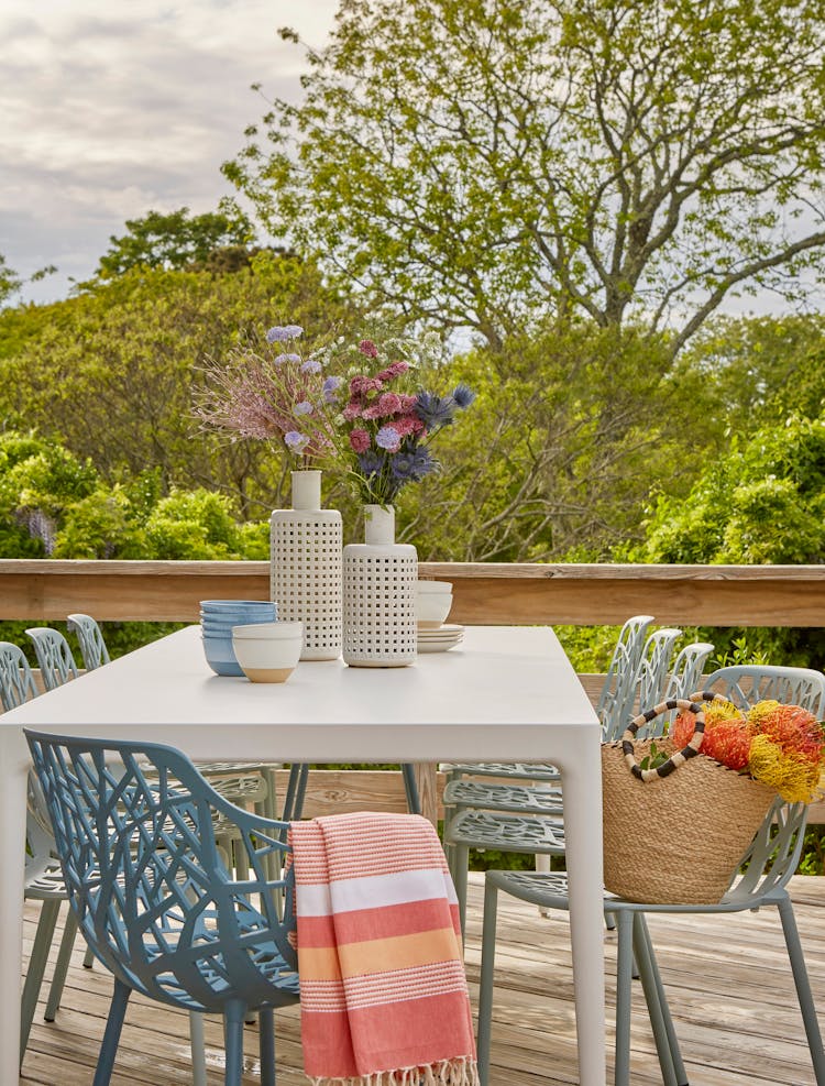 Outdoor dining area in a Montauk retreat, perfect for alfresco meals, designed by K.A. Murphy Interiors