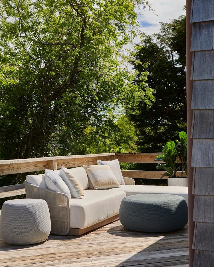 Inviting patio area in a Montauk beach house with comfortable seating and coastal views, designed by K.A. Murphy Interiors