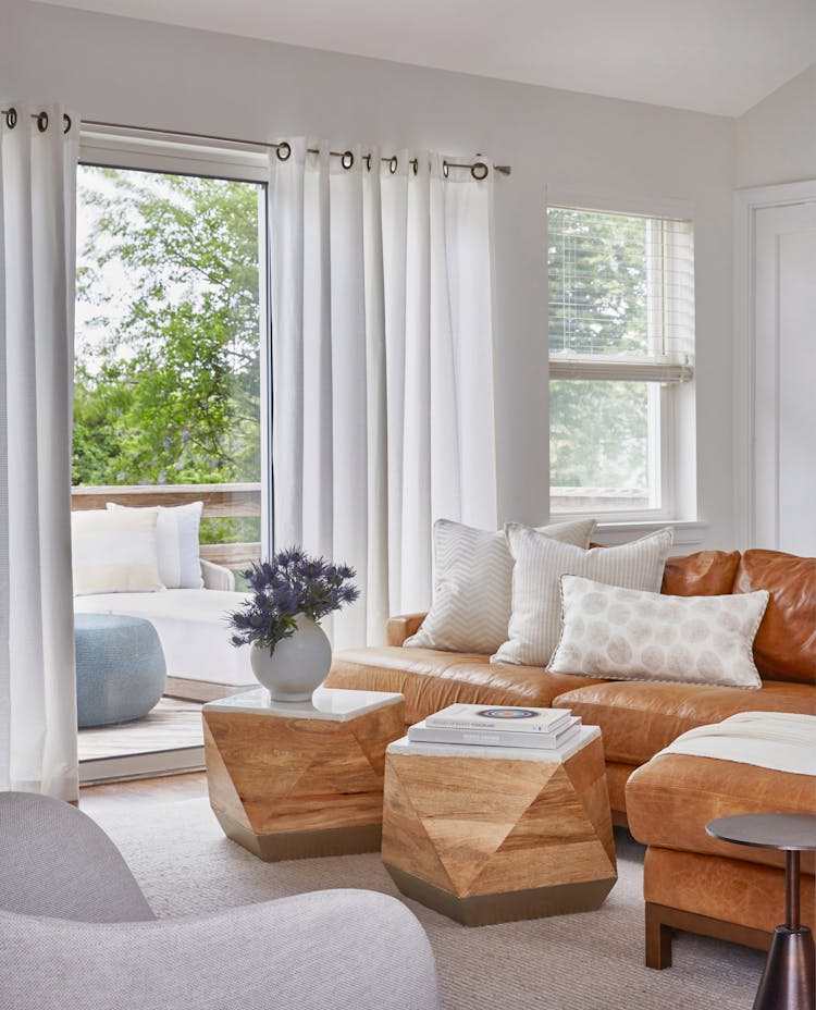 Close-up of family room in a Montauk beach house highlighting graphic textiles and lively decor, designed by K.A. Murphy Interiors