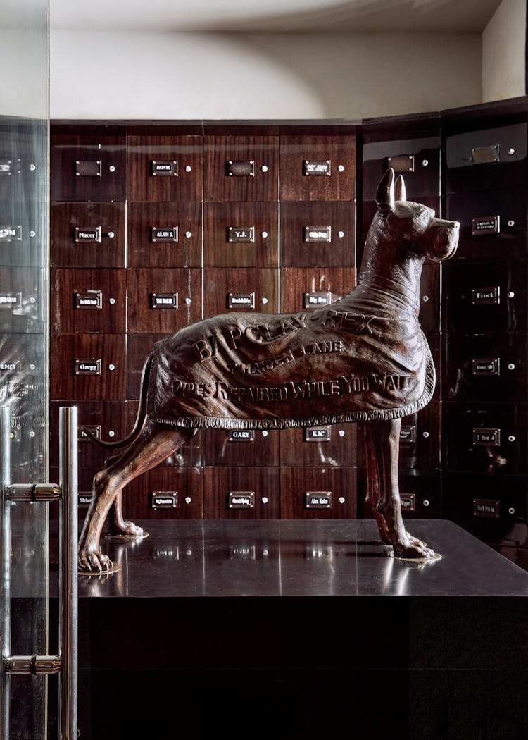 Sculptural dog statue adding character to a Lower Manhattan gentleman’s lounge, designed by K.A. Murphy Interiors