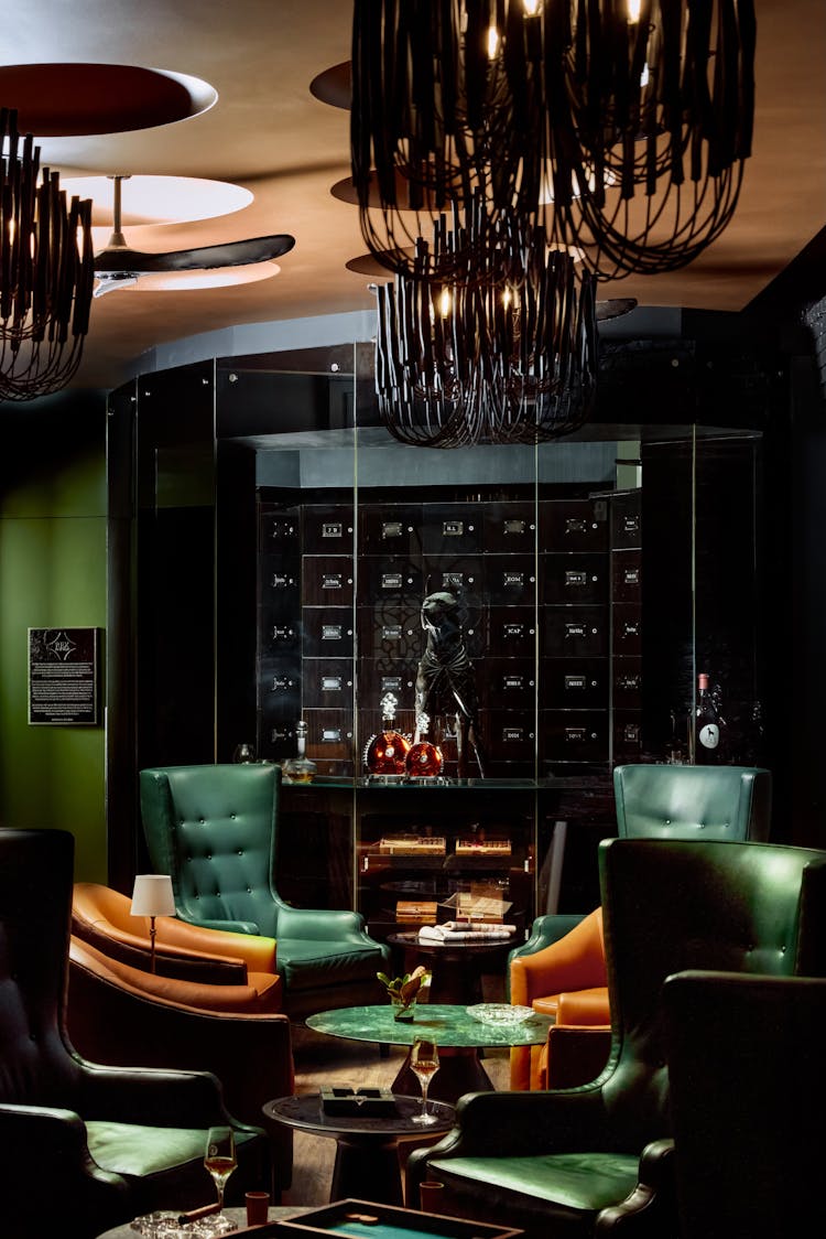 Arrangement of lounge chairs and tables in a Lower Manhattan gentleman’s lounge, designed by K.A. Murphy Interiors.