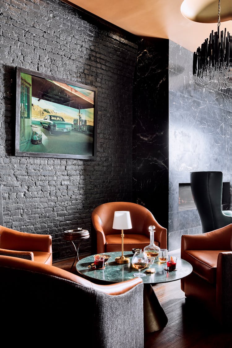 Arrangement of lounge chairs and tables in a Lower Manhattan gentleman’s lounge, designed by K.A. Murphy Interiors.