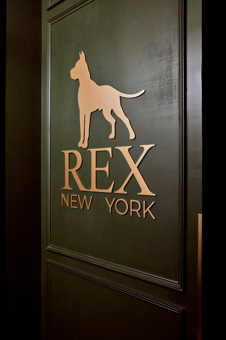 Stylish lounge door with brass handle in a Lower Manhattan gentleman’s lounge, designed by K.A. Murphy Interiors
