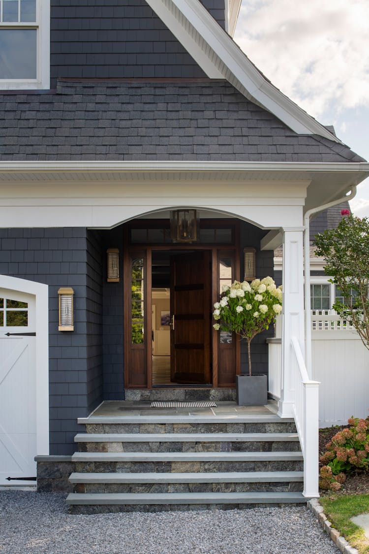Charming front exterior of a Long Island coastal home showcasing inviting architecture by K.A. Murphy Interiors