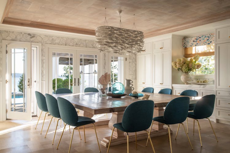 Spacious dining table in a Long Island coastal home, perfect for gatherings, designed by K.A. Murphy Interiors