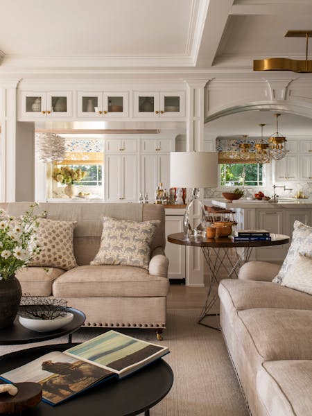 Open-concept Long Island living room transitioning seamlessly into a modern kitchen by K.A. Murphy Interiors