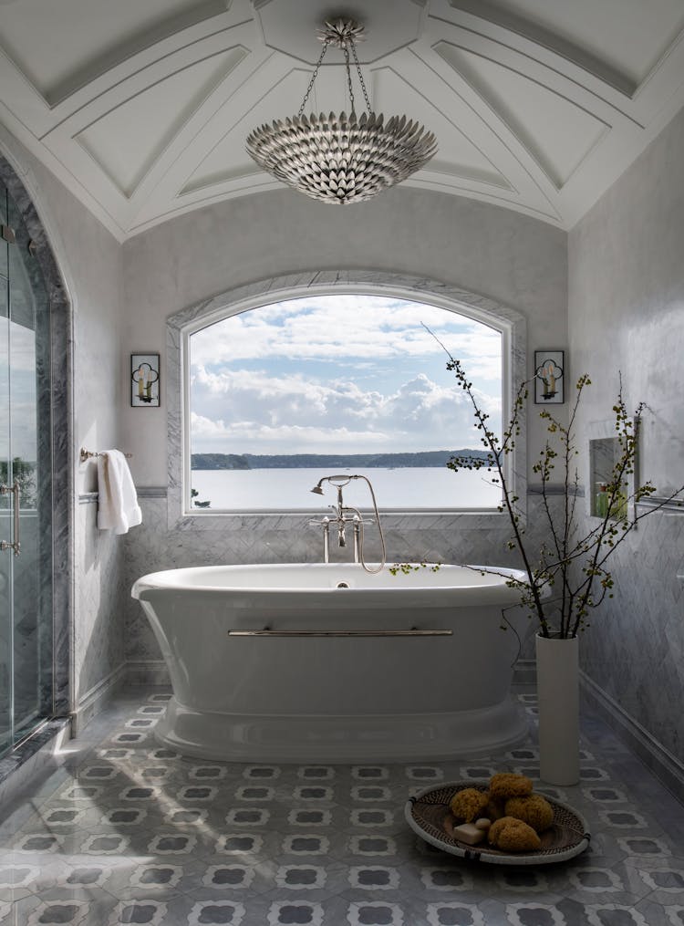 Freestanding bathtub in the master bathroom of a Long Island coastal home by K.A. Murphy Interiors