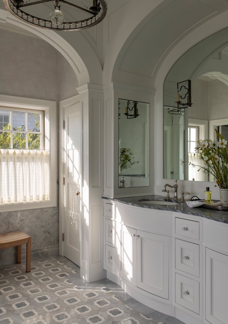 Luxurious master bathroom in a Long Island coastal retreat with spa-like features by K.A. Murphy Interiors.