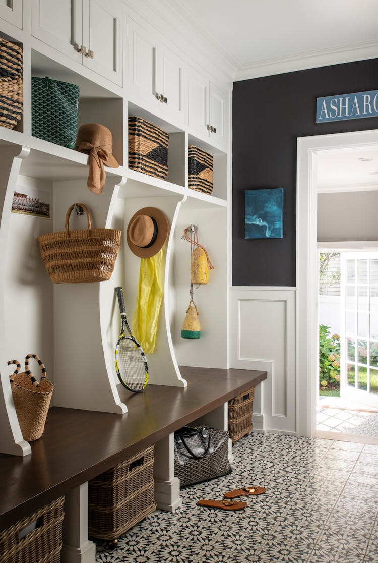Functional mudroom with built-in storage in a Long Island luxury coastal home by K.A. Murphy Interiors