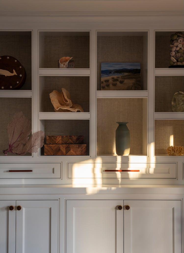 Custom built-in shelving in a Long Island coastal home, blending functionality and aesthetic appeal by K.A. Murphy Interiors