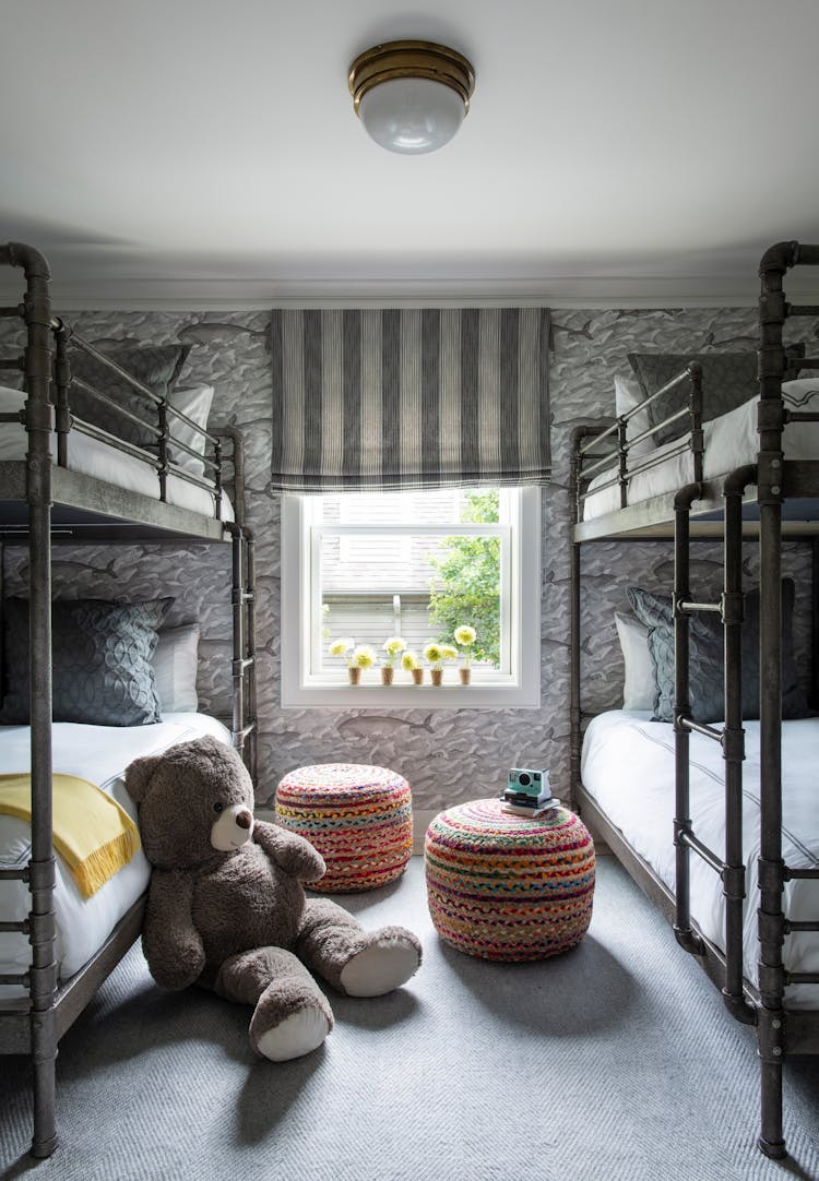 Playful bunk room in a Long Island coastal home designed for children by K.A. Murphy Interiors
