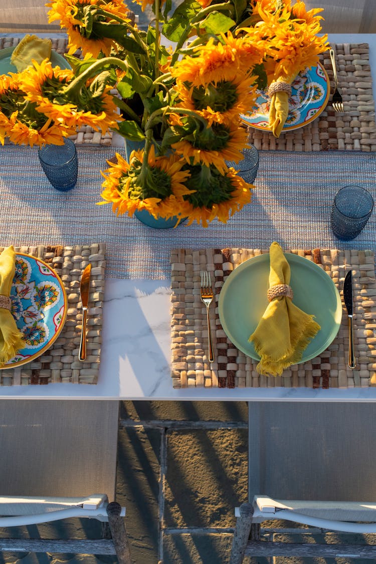 Elegant outdoor dining table in a Long Island coastal retreat, surrounded by comfortable seating by K.A. Murphy Interiors