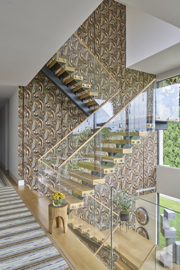 Elegant foyer in a Hamptons show house, featuring earthen tones and layered textures, designed by K.A. Murphy Interiors
