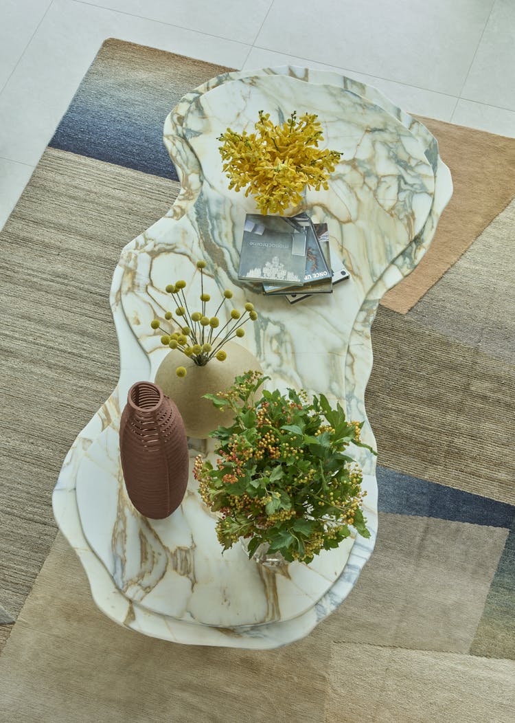 Elegant foyer in a Hamptons show house, featuring earthen tones and layered textures, designed by K.A. Murphy Interiors