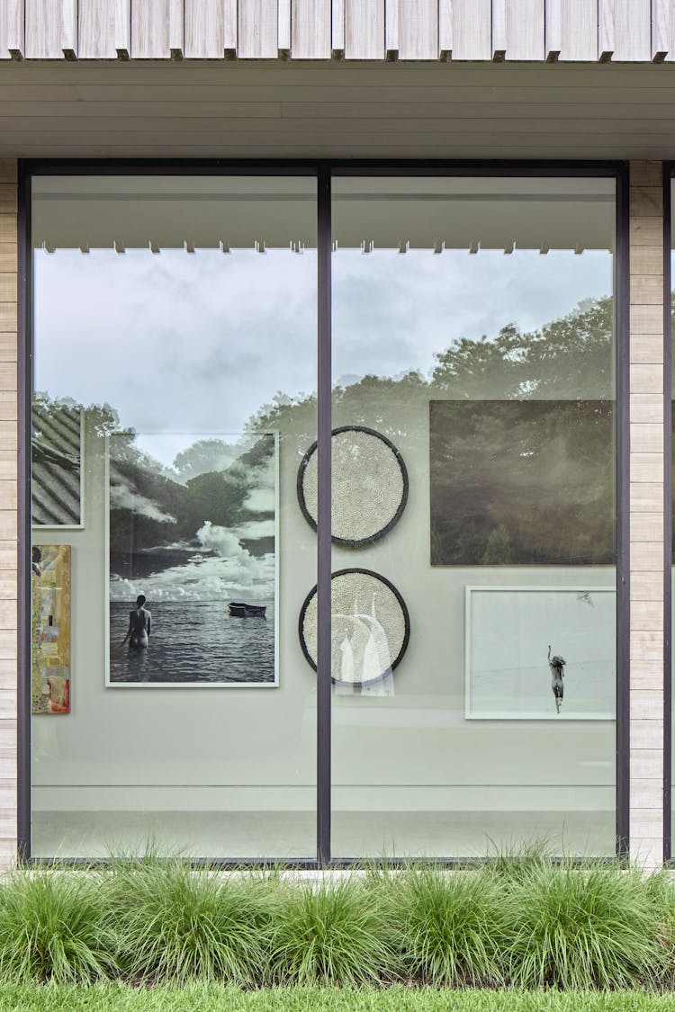 Vintage photography from The Select's Gallery adorning the walls of a Hamptons show house foyer, designed by K.A. Murphy Interiors