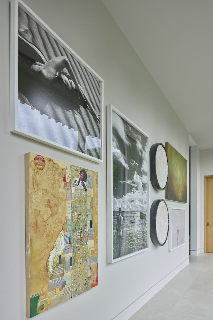 Vintage photography from The Select's Gallery adorning the walls of a Hamptons show house foyer, designed by K.A. Murphy Interiors
