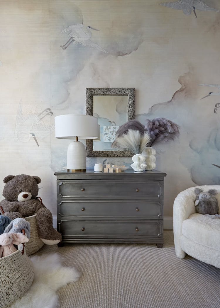 Comfortable corner chair with soft upholstery in a New York nursery, designed by K.A. Murphy Interiors