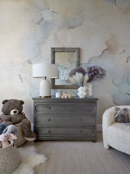 Comfortable corner chair with soft upholstery in a New York nursery, designed by K.A. Murphy Interiors