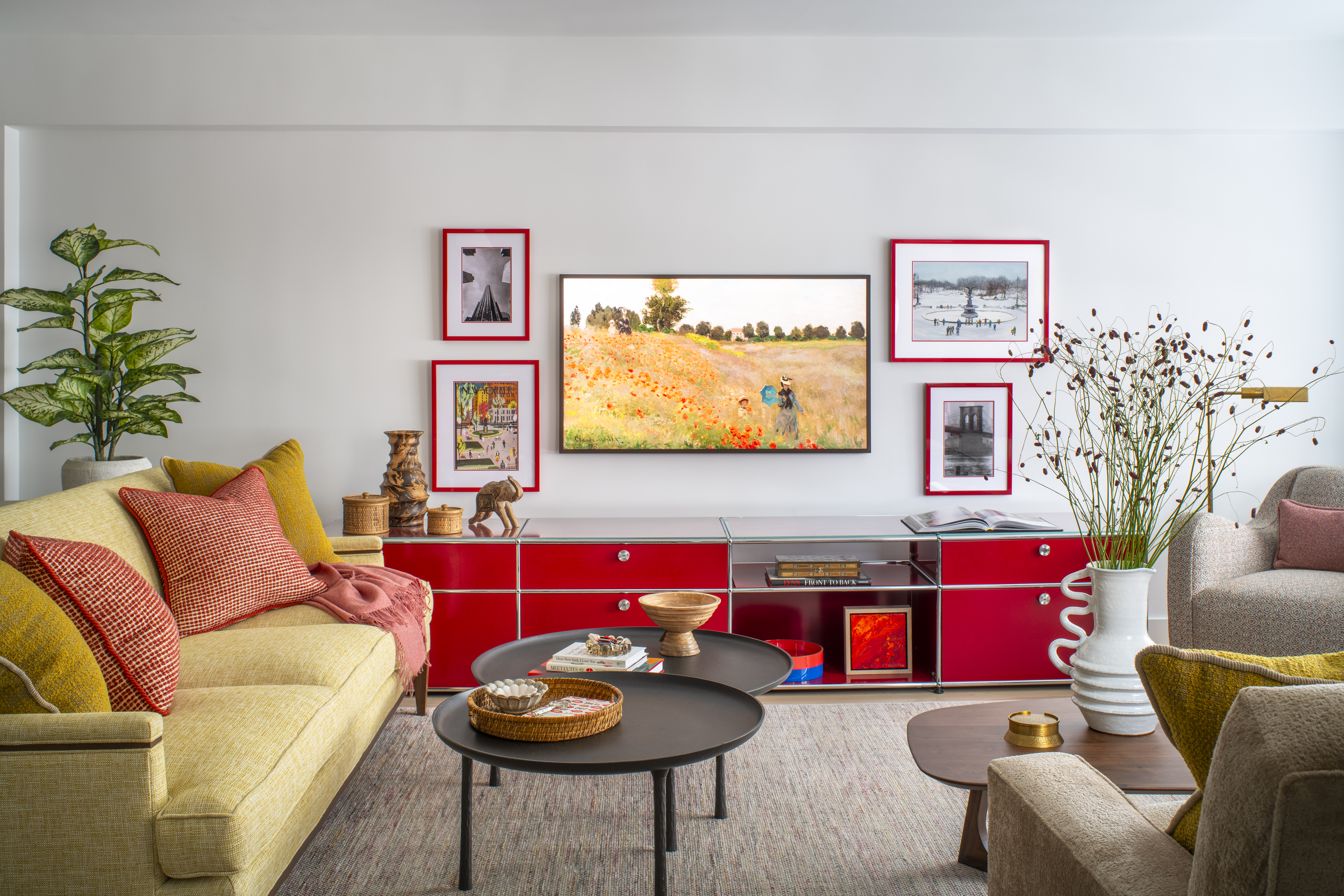 Greenwich Village living room featuring a bold red console, curated artwork, and layered seating in a colorful apartment designed by K.A. Murphy Interiors.