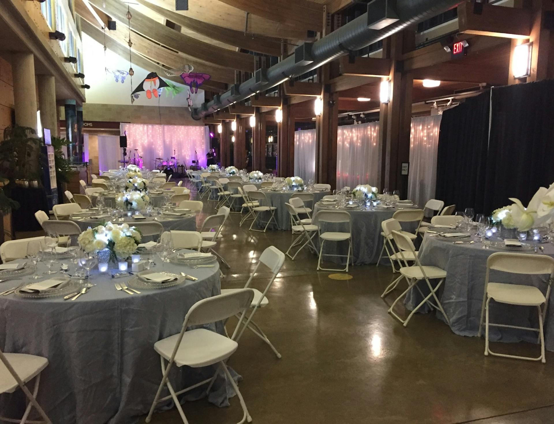 decorated tables and chairs set up in Deramus Lobby