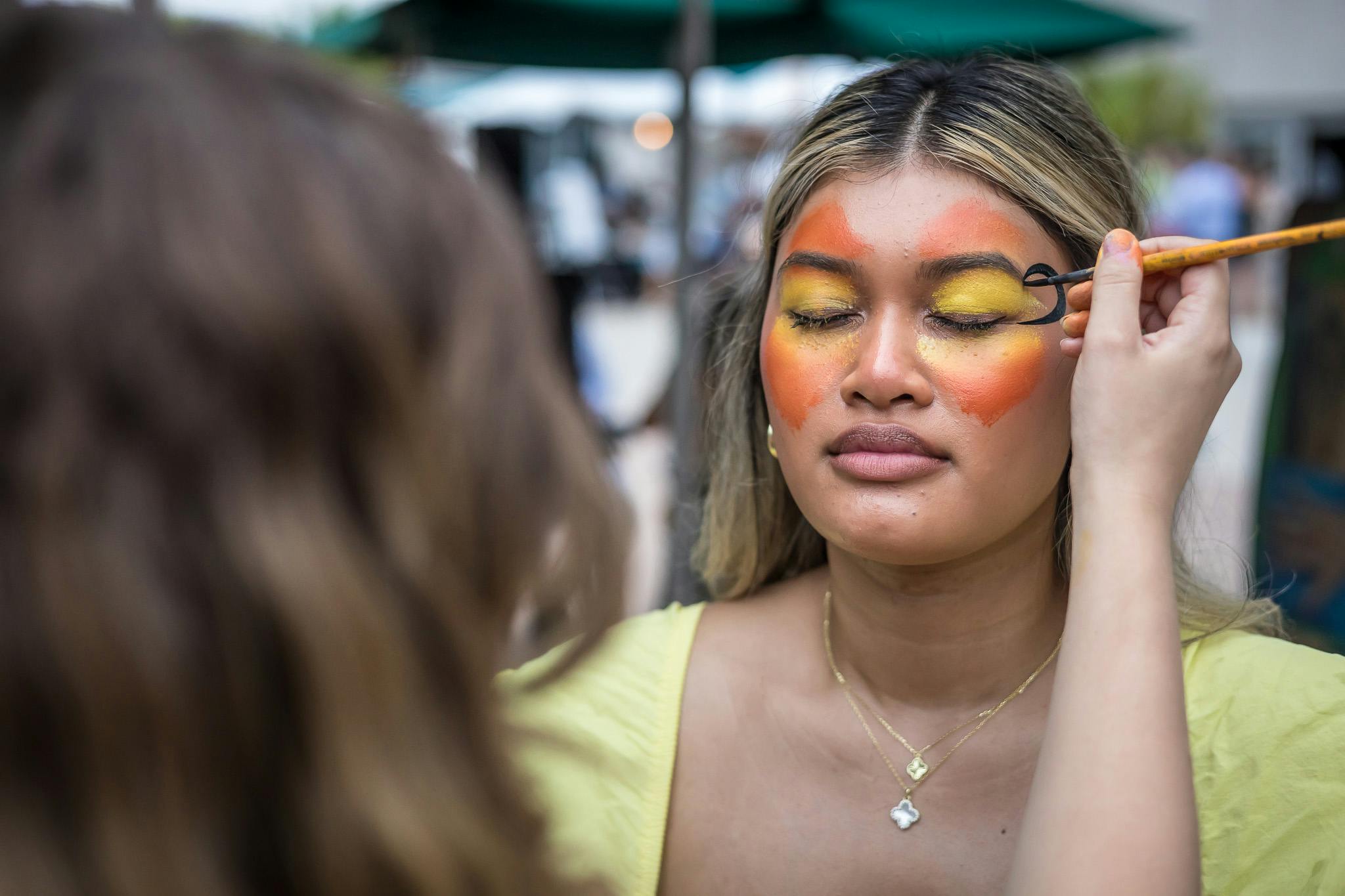 Guest getting face painted at Jazzoo.