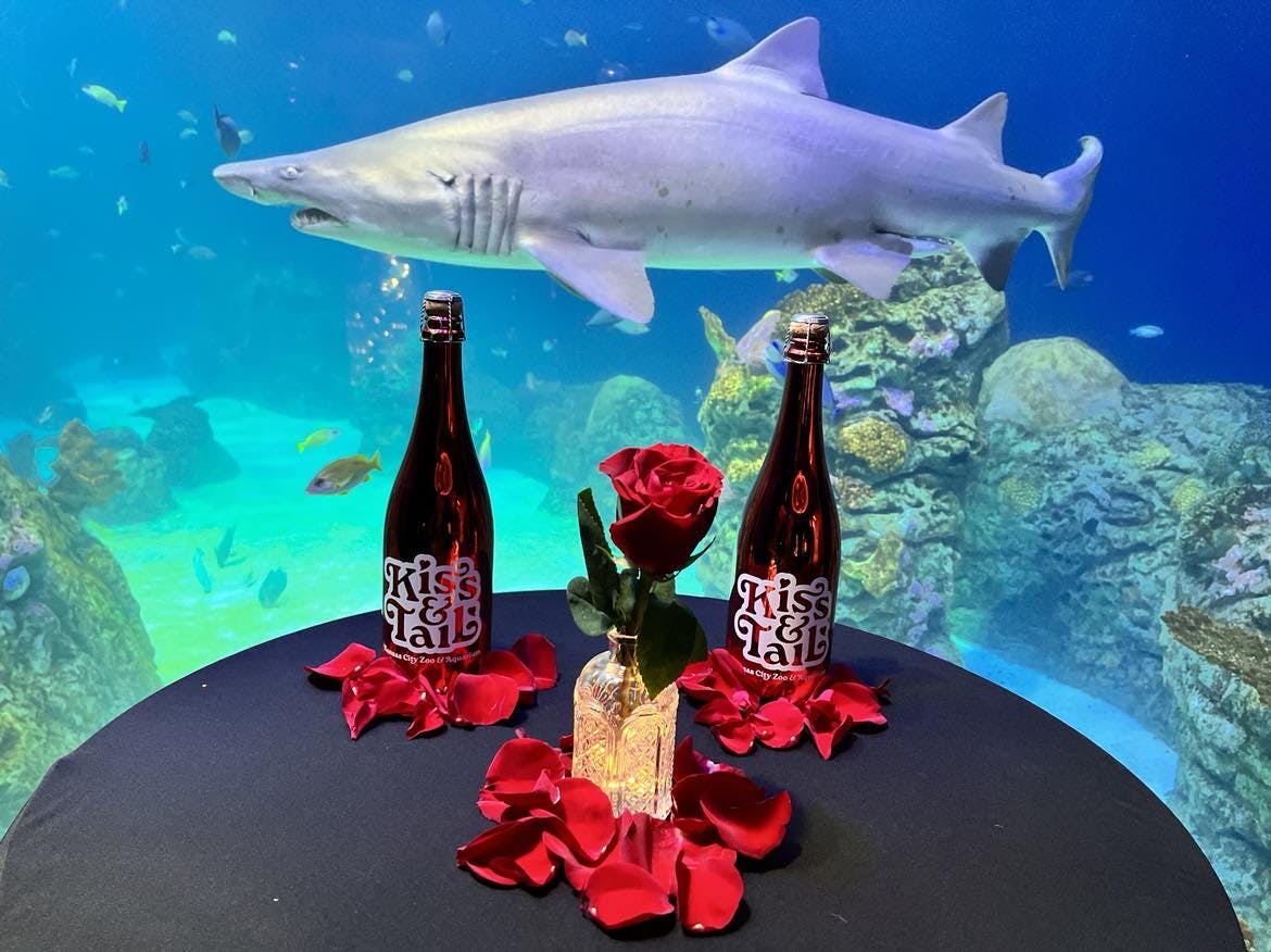 Kiss & Tail bottles at a dinner table