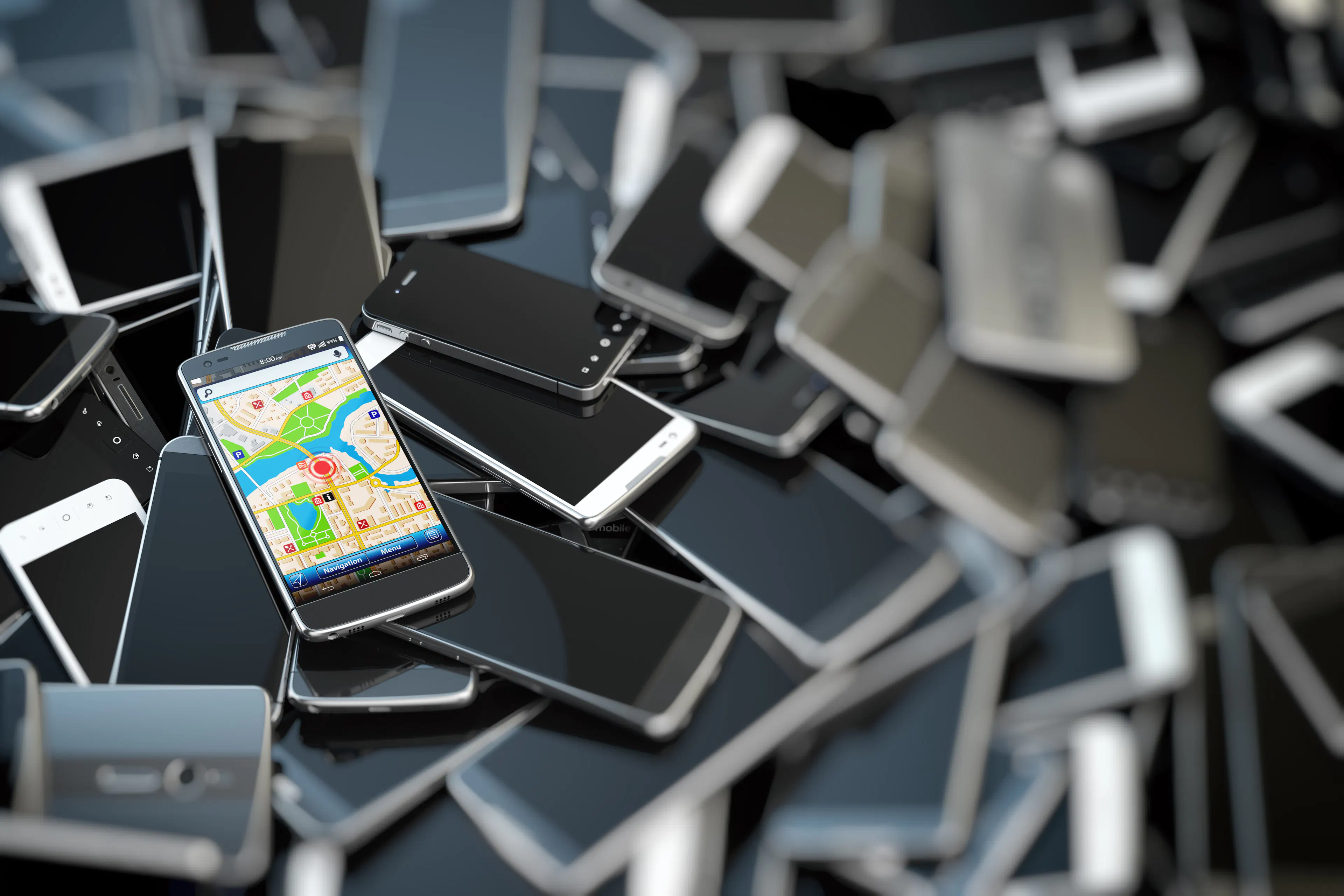 a pile of broken phones being recycled.
