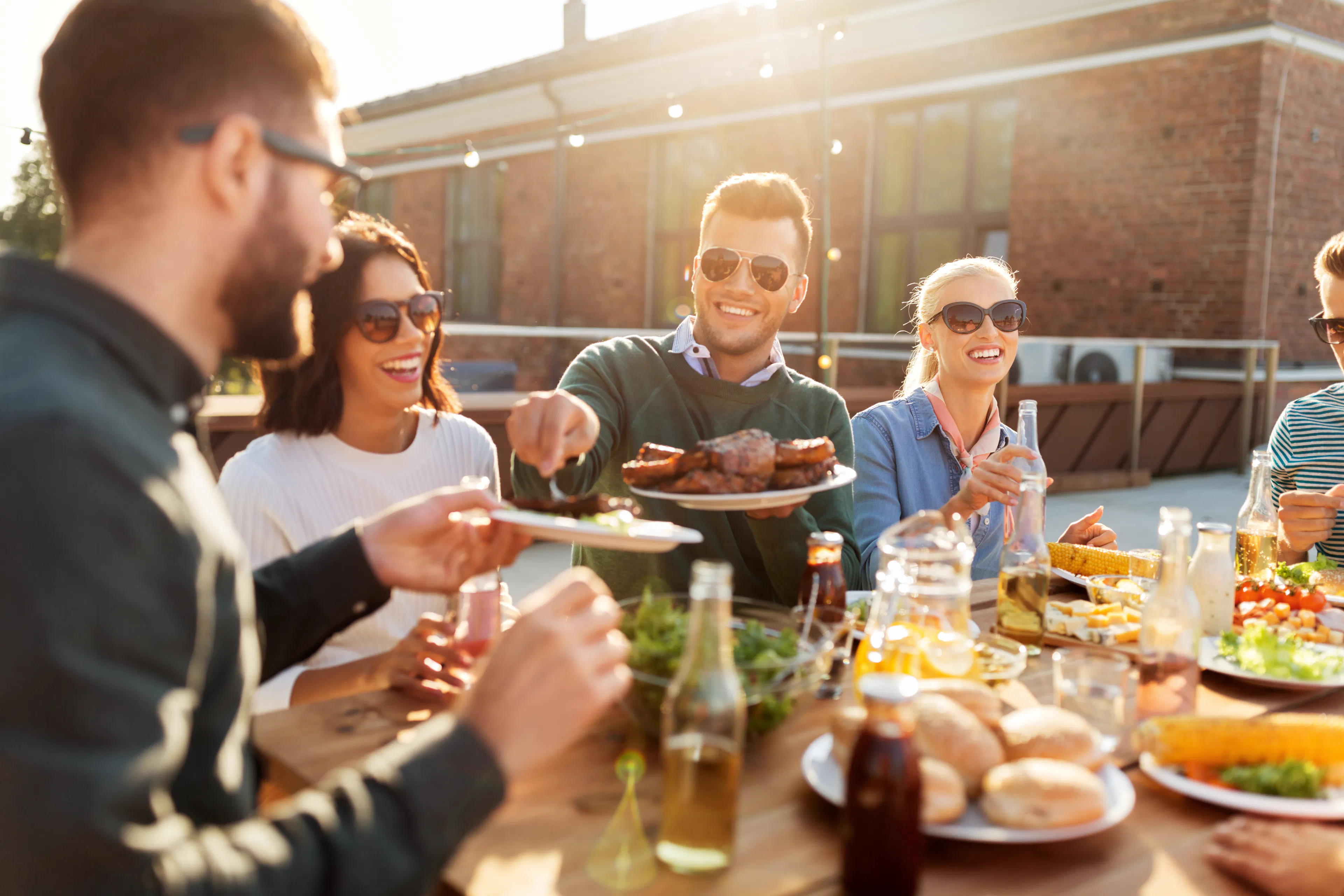 friends enjoying a cookout at a table