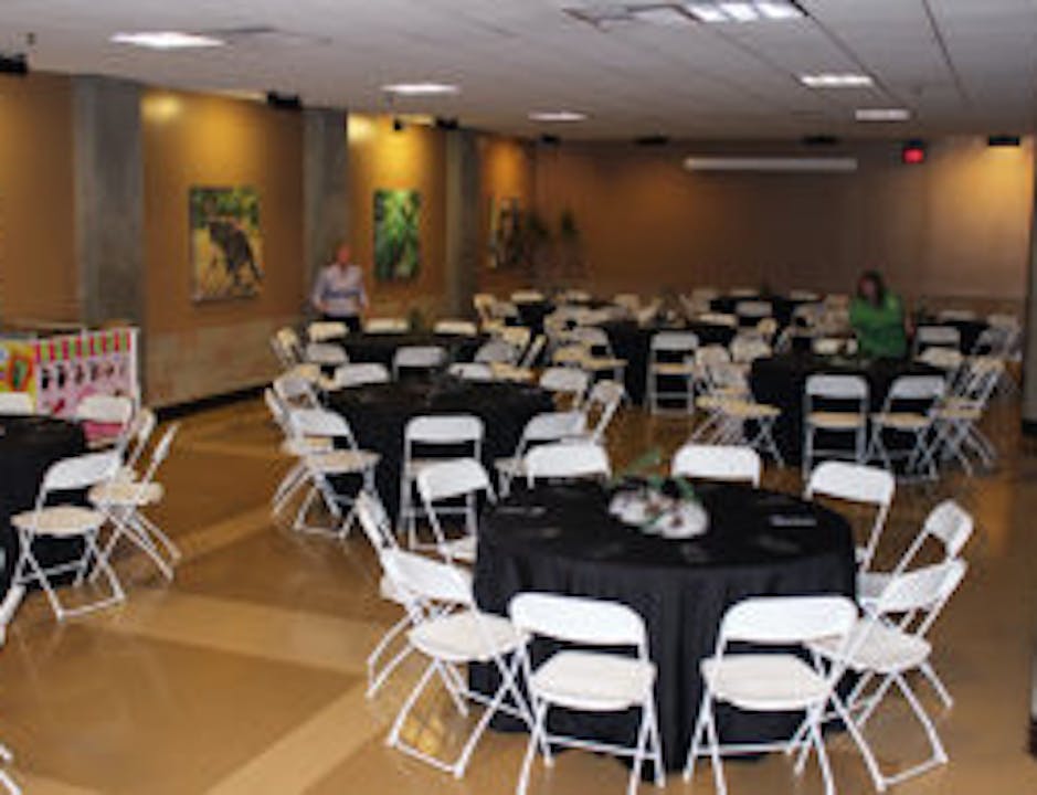 room set up with round tables and chairs banquet style