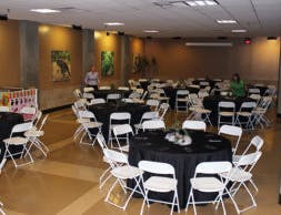 room set up with round tables and chairs banquet style
