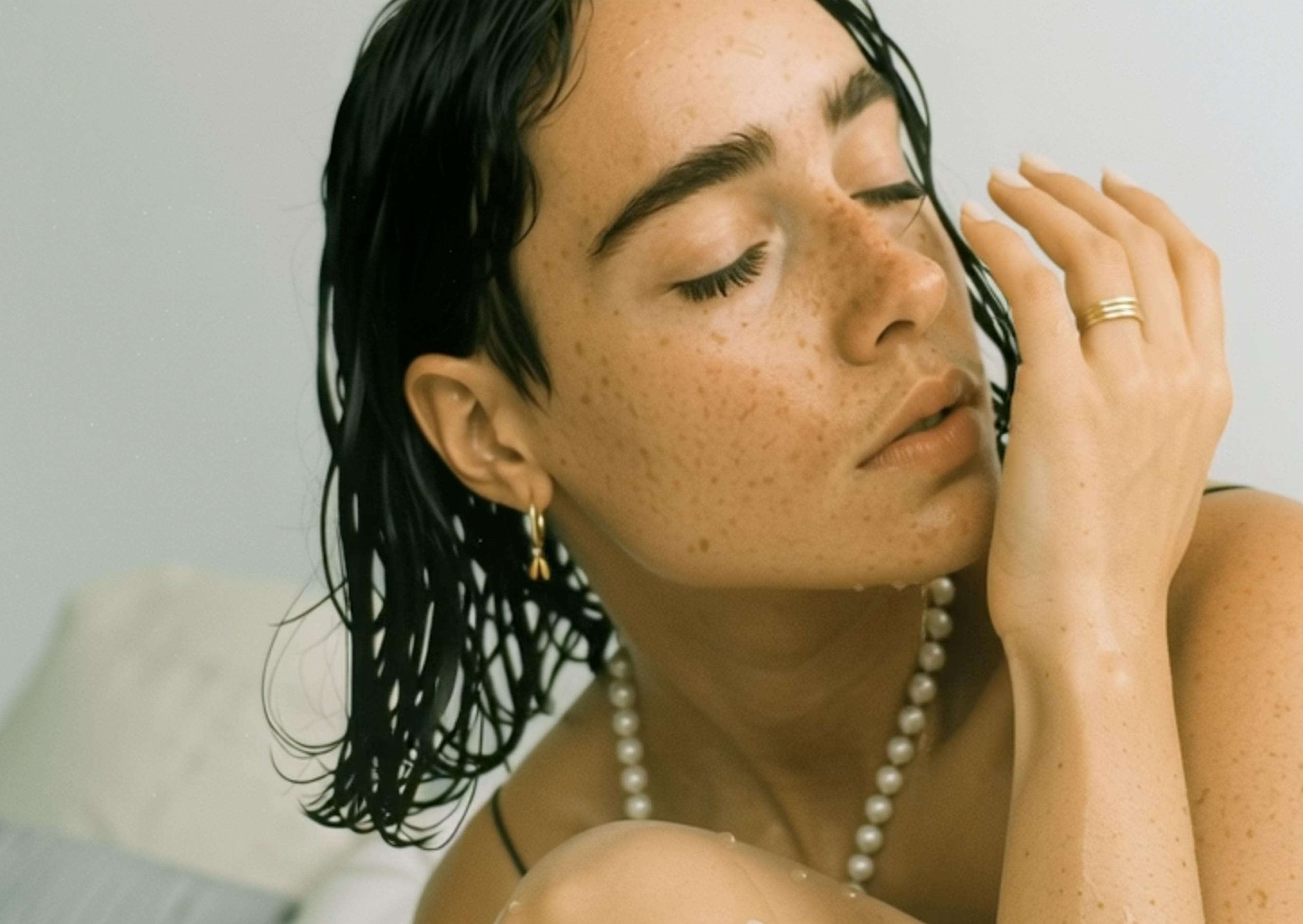 woman smelling her wrist