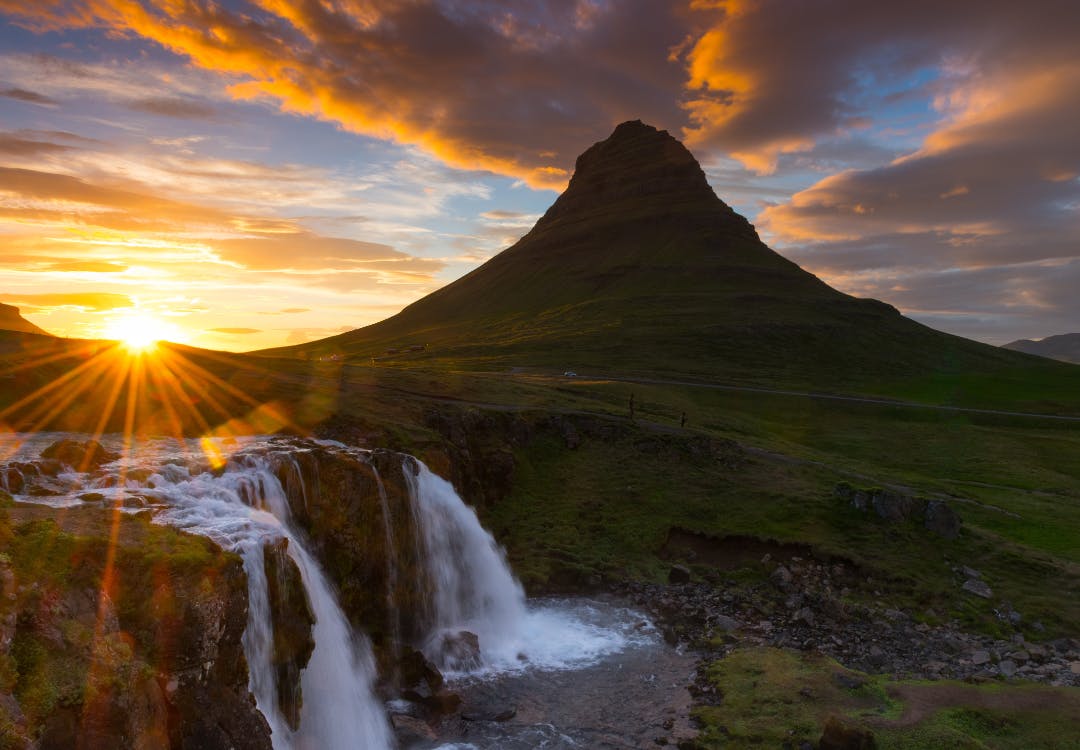 Sun behind a mountain