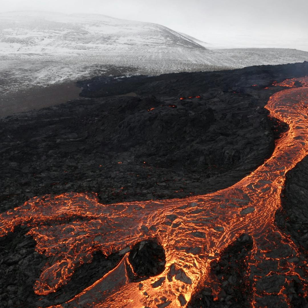 Lava flowing over landscape in Iceland